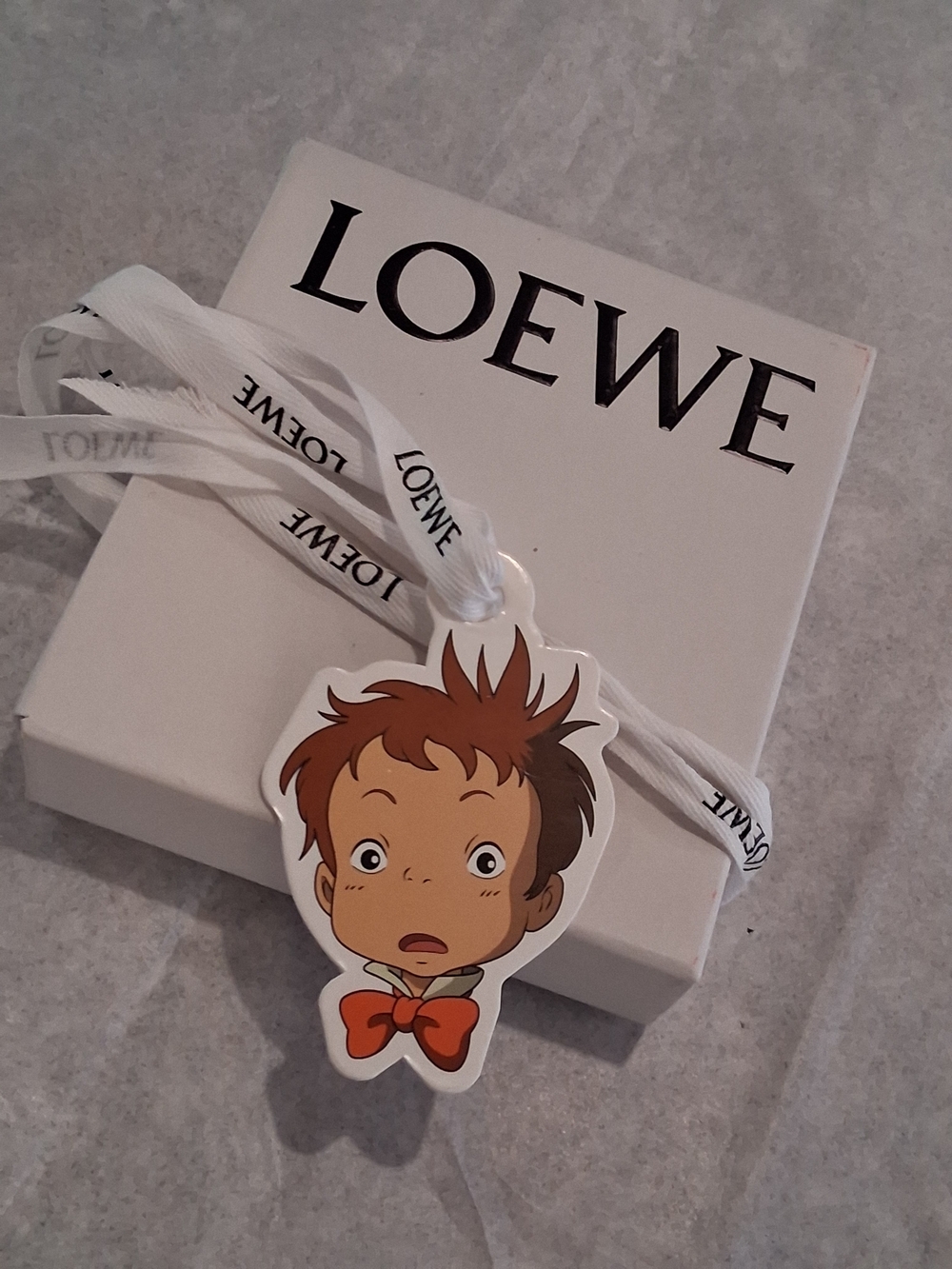 LOEWE Empty Box Cartoon Character Tag With Ribbon in White.